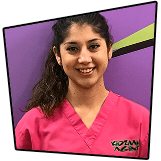 Norma, lead dental assistant smiling